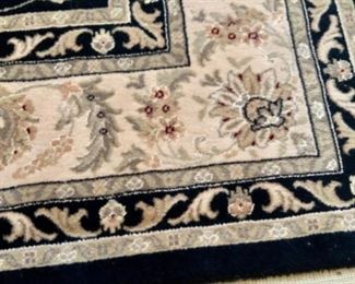 $150- 10ft’L x 80in’W. Persian Area Rug Black Background with pad underneath.