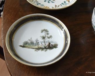 5" round shallow dish $12
Image of man hiking and one sitting on a log.
cobalt blue and gold edging. Three faint Xs on the back