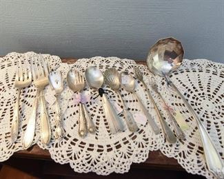 Lot of sliverplate spoons, a ladle, pickle forks, etc. $25