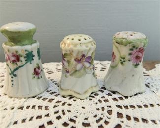 Three porcelain painted hat pin holders. The tallest is 3" $12