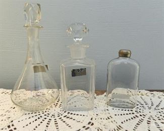 19th Century crystal wine decanter. 10" $35
19th Century Whiskey decanter. $30
small chips on several facets of stopper. 8" tall
Circa 1910 glass flask with metal screw-on top. 5.5" tall $22