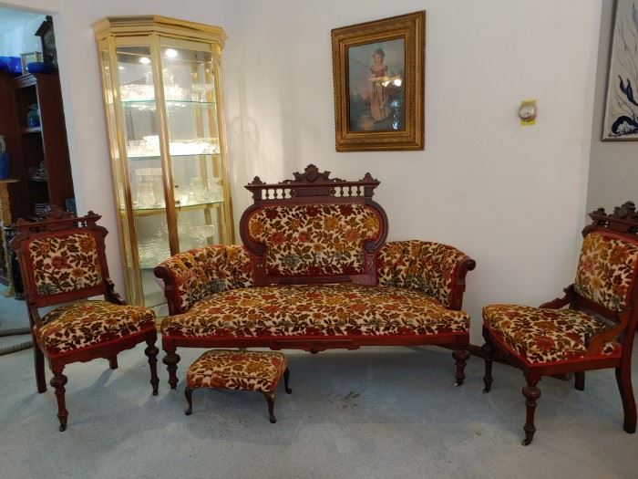 Eastlake settee, side chairs, platform rocker, stools. Large "brass" etagere filled with clear crystal and eapg. Stacked frame with antique print.