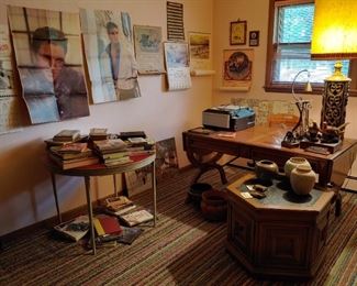 beautiful desk with chair. large mid-century lamp. pottery and brass pots. calendar collection. printer. books