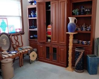 entertainment center. steeple clock, pottery, victorian lemonade pitcher with matching tumbers, stained glass items.