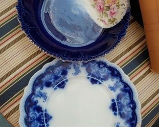 flo-blue plate and service bowl. detail of upholstery on dining room chairs.