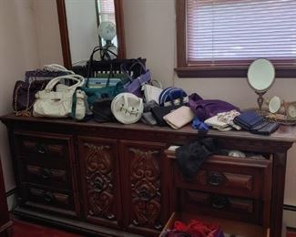 full dresser with attached mirror. purses. coach.