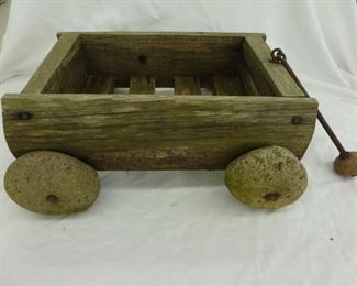 Small Wooden Cart with Rock Wheels 