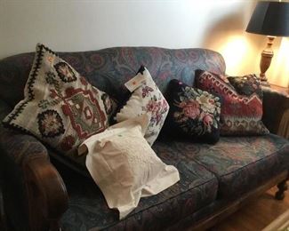 Vintage sofa with cushions.