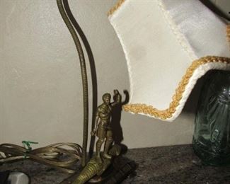 Antique brass lamp: Man conquering alligator 