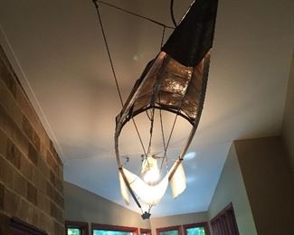 This canoe light creation is a 21 foot long conversation starter. It was made in New York 30 years ago. Its showing light patina but it is solid. Taking offers, it needs a new home 
