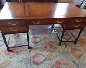 Leather and wood inlayed desk with wrought iron stands (x2 very heavy). 