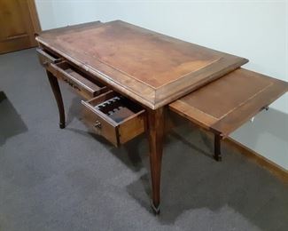 Antique table with expanding side panels from France
