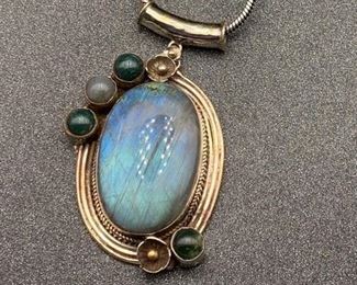Silver and brass labradorite and jade pendant with snake chain from Tibet (spots are from the light box)