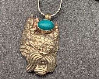 Silver and brass dragon head pendant with turquoise accent and snake chain from Tibet