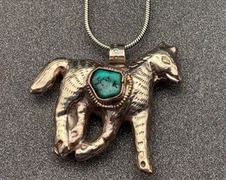 Silver and brass trotting horse pendant with turquoise accent and snake chain from Tibet