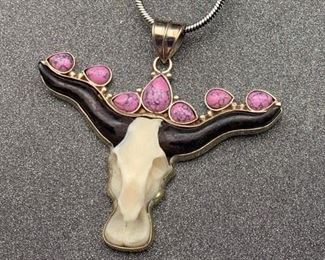 Silver and brass faux cow skull pendant with flower details and snake chain from Tibet