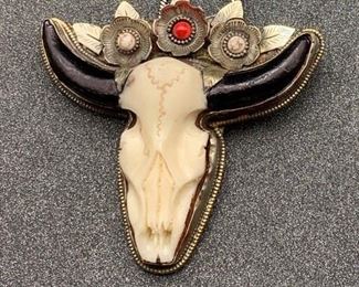 Silver and brass faux cow skull pendant with flower details and snake chain from Tibet