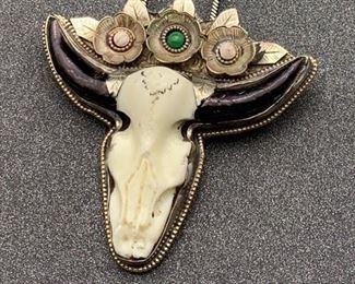 Silver and brass faux cow skull pendant with flower details and snake chain from Tibet