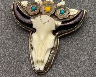 Silver and brass faux cow skull pendant with flower details and snake chain from Tibet