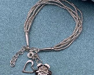 Fine silver adjustable multi-strand bracelet with floral and heart charms from Thailand