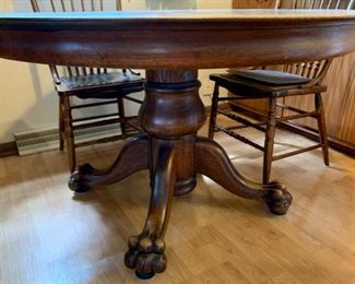 Base View: Antique Round Oak Large Claw Foot Table with 5 Leaves and 5 Chairs (A169)