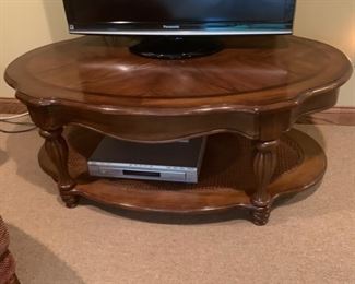 CLEARANCE ! $15.00 now, was $80.00.......Coffee Table with Cane Base Shelf ,three very small circular stains 50” x 29”, 20” tall