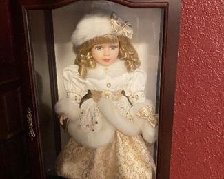 Doll in display case