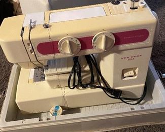 New Home sewing machine in travel case