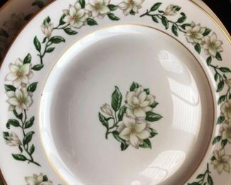 Close up - gold rimmed, magnolia pattern