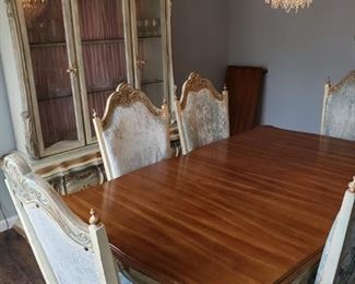 Ice blue vintage velvet chairs, seating for 6. Pink lined china cabinet. 