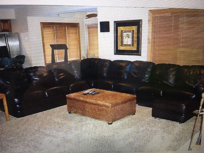 Black leather sectionals with Ottoman   Fabulous like new . Original cost $5500.-  Now $2500