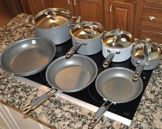 GREAT KITCHEN-AID POTS AND PAN! THREE PANS IN FRONT, OUR PRICE $65.00.  THREE SAUCE PANS, #1, #2 AND #4 OUR PRICE $125.00.  SAUCE PAN SLIGHTLY DISCOLORED OUR PRICE $40.00.  