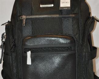 NEW WITH TAGS! BLACK LEATHER AND NYLON TUMI BRAVO SHEPARD DELUXE BRIEF PACK (HOLDS A 15" COMPUTER), 10.5"W X 17"H X 4"D. OUR PRICE $375.00
