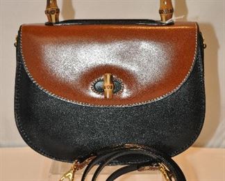 LOVELY SMALL BROWN AND BLACK LEATHER HANDBAG WITH SHOULDER STRAP AND BAMBOO HANDLE (NO MANUFACTURER IDENTIFIED)  IN EXCELLENT CONDITION. 8”W X 6.5”H X 3”D.  OUR PRICE $95.00