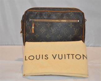 AUTHENTIC SMALL MONOGRAM CANVAS LOUIS VUITTON COSMETIC BAG WITH ZIPPER POCKET FRONT,  IN VERY GOOD CONDITION,(WITH DUST BAG), 8.5"W X 5.5"H X 1.75"D. OUR PRICE $125.00