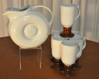 VINTAGE HALL 7.25"WHITE PITCHER AND A SET OF 6 VINTAGE HALL 5.75" FOOTED WHITE AND BROWN COFFEE MUGS. OUR PRICE $50.00 SET