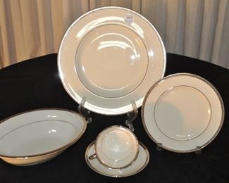 TIMELESS THEODORE HAVILAND, NEW YORK, LIMOGES  "SHELTON" CHINA. 4 PIECE PLACE SETTING FOR 8 CREAM WITH A SILVER BAND. OUR PRICE $225.00