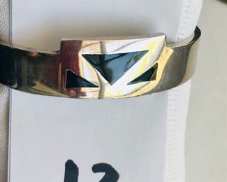 Heavy sterling onyx inlay cuff bracelet.  Inside measures 2.5"  Weight 50.9 grams - $125.00