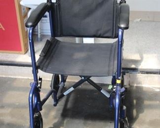 $50. Transport wheelchair. Folds for easy storing or in the car. Removable foot rests.