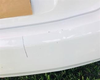FEW SMALL BLEMISHES ON CAR BUMPER