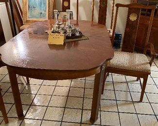 Dining table with 6 chairs two arm, 4 regular, wood on table top and two of the chairs needs some repair.  We have priced the entire set at $380.00 One of our sale specials.