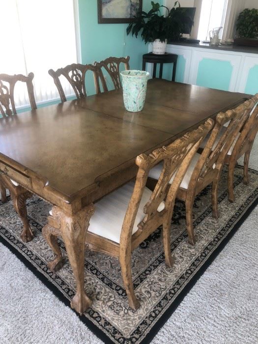 Dining table 42"x 68" w/2-18" leaves in Blond finish w/taupe crackle claw & ball legs w/ 6 matching side chairs.  Rug in black&neutrals. 