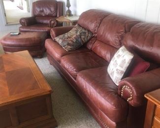 La-Z-Boy "The American Collection" burgundy leather 87" rolled arm sofa w/loose set & fixed back cushions.  Matching reclining lounge chair 38" x 36"  w/ ottoman
