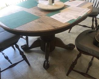 Early American Oak ball & claw feet pedestal table 42" rd. w/ 2-10" leaves.  4-Hickory Chair "Windsor" back side chairs @ 16"x 16"x 38" high