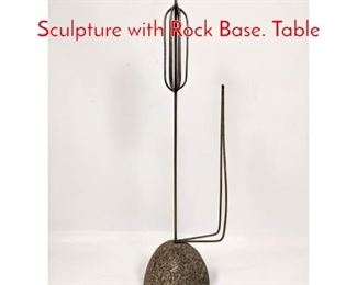 Lot 178 Modernist Iron Cattail Sculpture with Rock Base. Table 