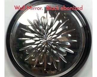 Lot 241 Fornasetti Style Cut Round Wall Mirror. Black ebonized