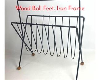 Lot 383 Tony Paul Magazine Rack with Wood Ball Feet. Iron Frame