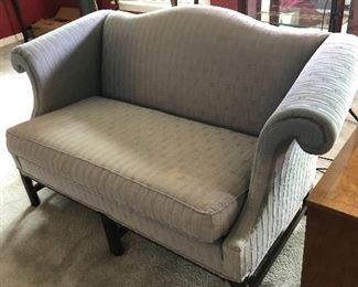 74.  Grey Upholstered Kittinger Settee, Discoloration on Cushion and Back, $100.00