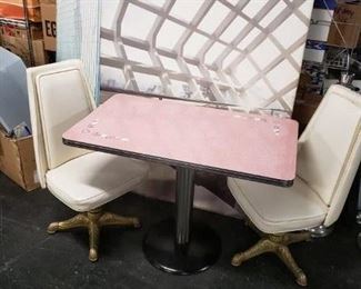 MCM Pink rectangular formica top with white & gray floral design on opposite corners,  chrome trim & base cylinder with black painted round metal base Table only $295 Off-white vinyl swivel chairs on gold metallic legs Chairs only $295  Set complete $495   