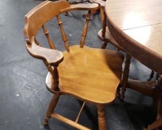 Solid Oak Table with Wood Grain style laminate top with leaf & 4 solid wood Captains armchairs Table 42" diameter Leaf 10" W       $295